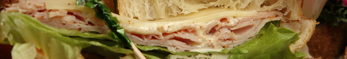 Eating Deli Sandwich at Fratellis Italian Gourmet Market restaurant in Amityville, NY.